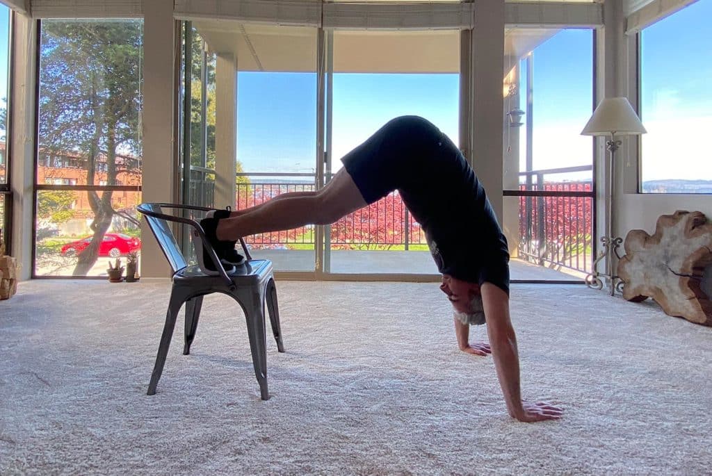 Grab A Chair For These 6 Challenging Strength Exercises 7 pike press