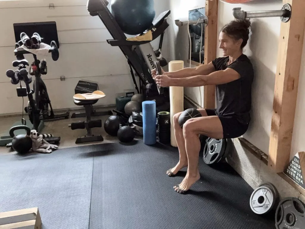 Isometric Strength Training: A Safe, Simple, and Effective Path to Better Running 5 Wall sit heels elevated ball squeeze plate hold ISO sized