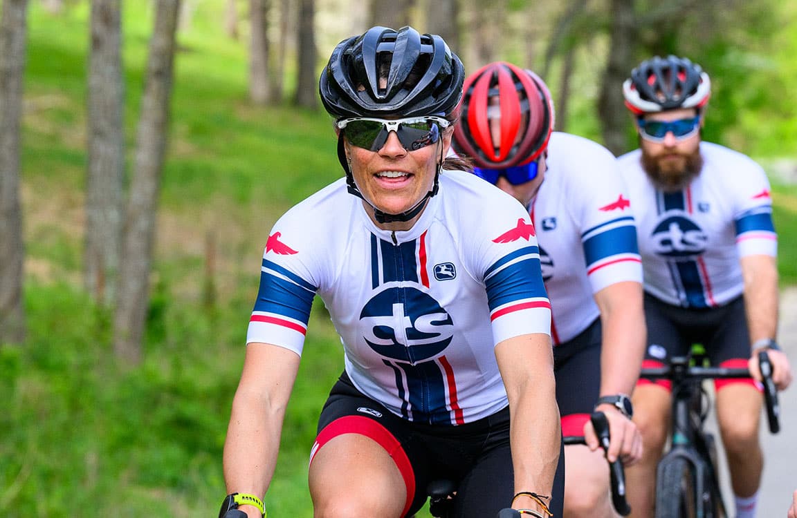 three cyclists riding in a line