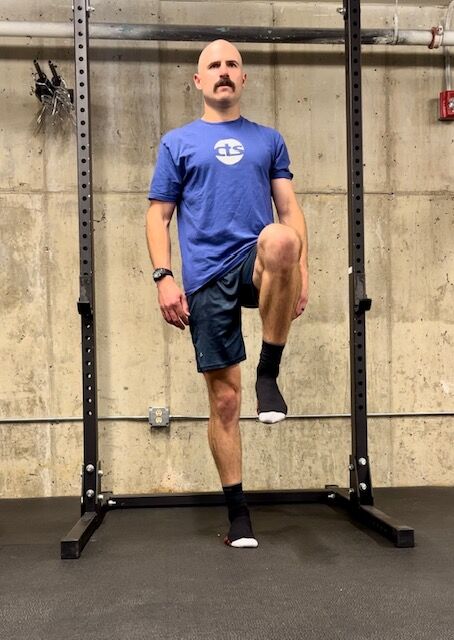 trail running injury prevention exercise - standing on one foot