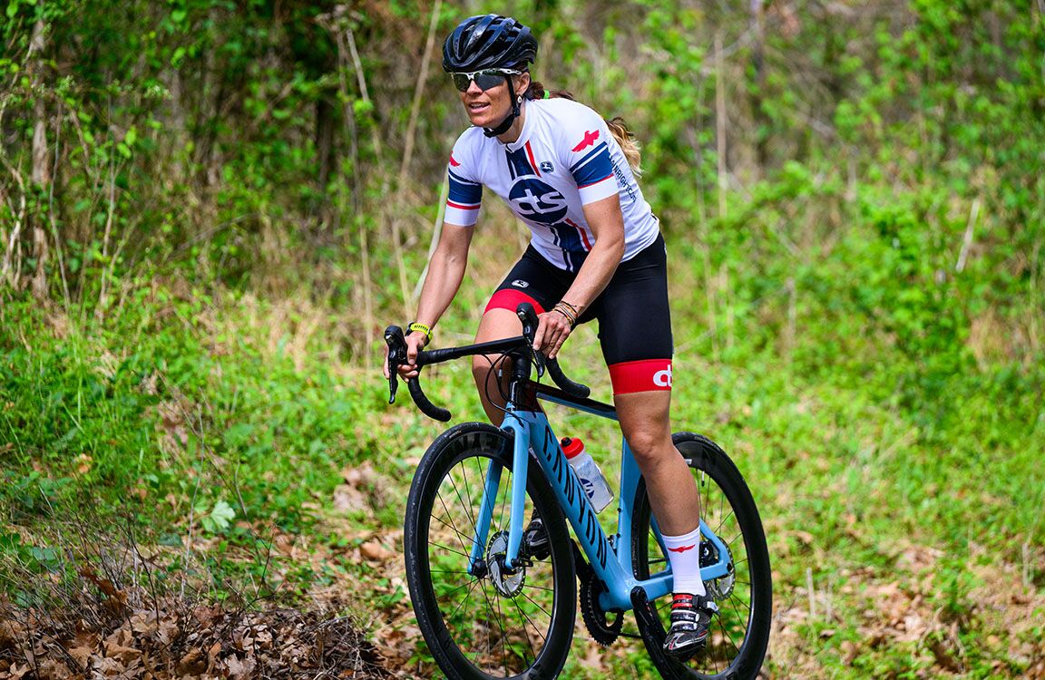 female road cyclist standing