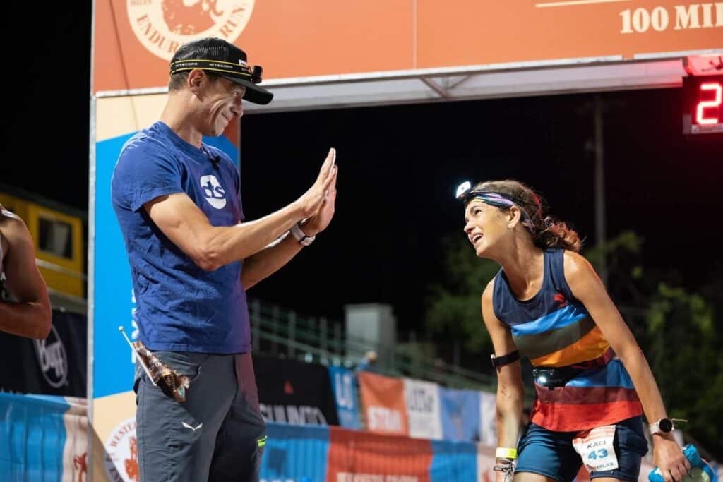 Kaci Lickteig finishing her 10th Western States 100 with Coach Jason Koop at the finish line.