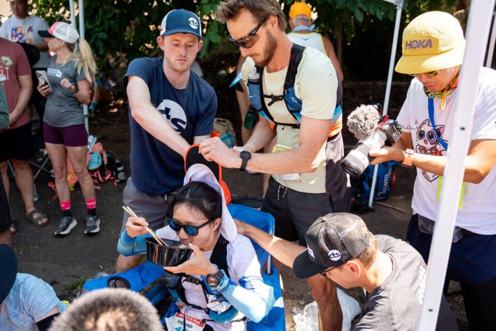 Fuzhao Xiang eating noodles during Western States Endurance Run