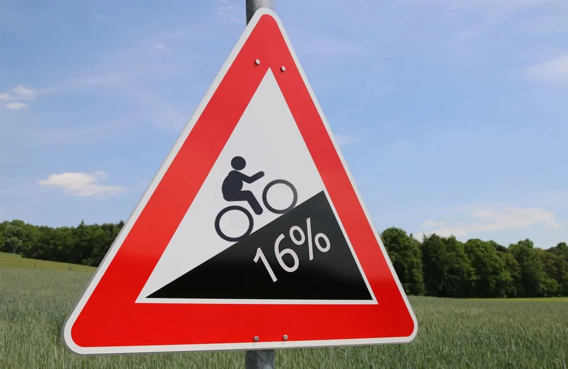 fat cyclist uphill