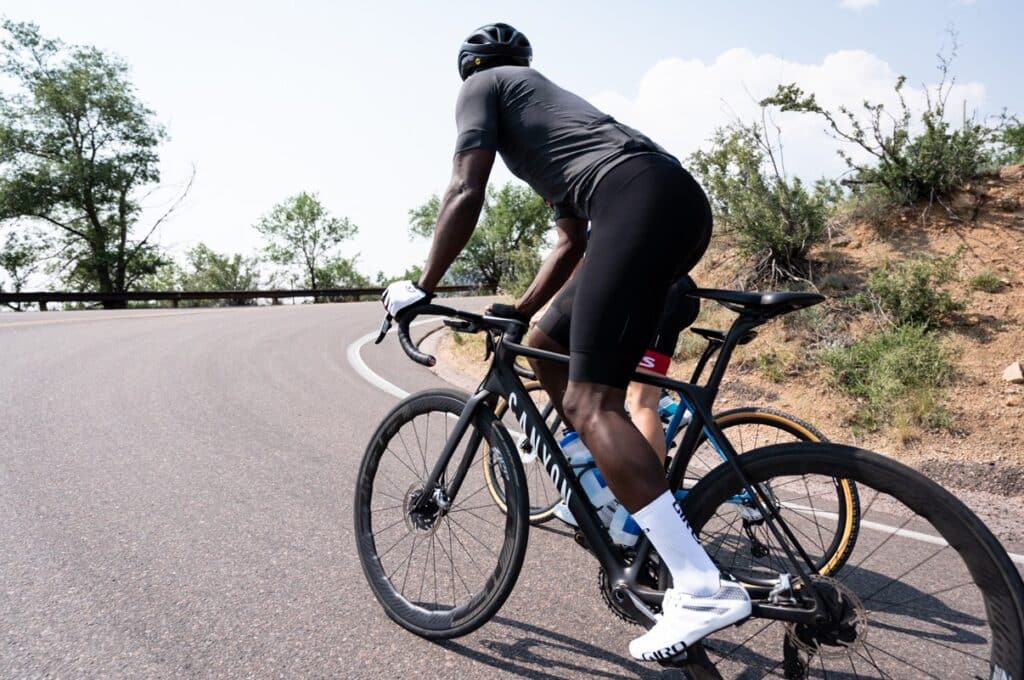 Cyclists: Seated and Standing Climbing Mechanics to Ride Uphill Faster 7 climbing position hips forward
