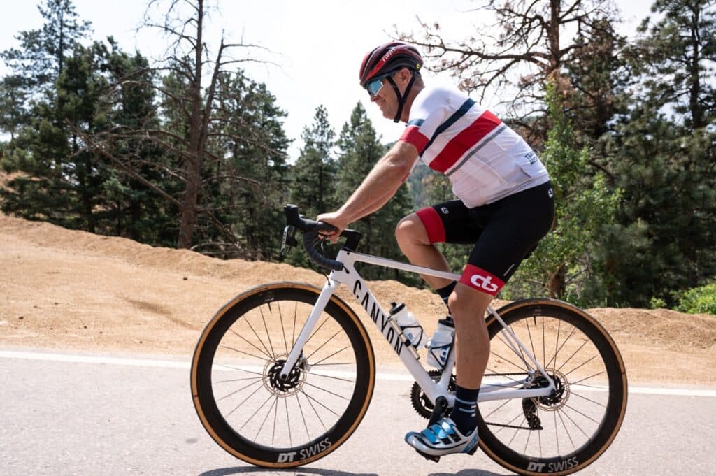 Cyclists: Seated and Standing Climbing Mechanics to Ride Uphill Faster 4 rear seated climbing position on road bike