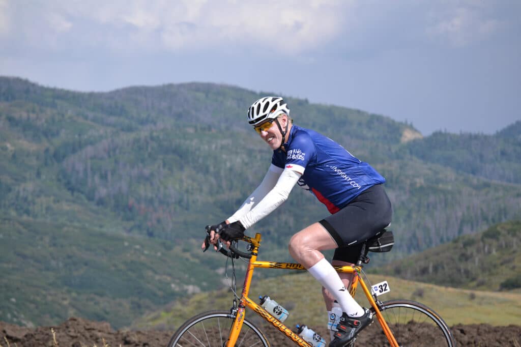Bill Walton riding his bike during the 2014 USA Pro Challenge Experience with CTS.