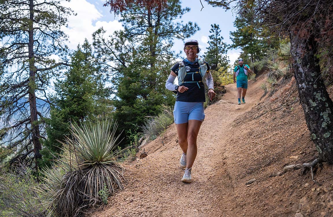 female trail runner downhill